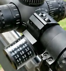 R1 RealShot reel fitted beside a scope ring